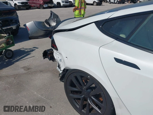 2022 Tesla Model S Plaid with VIN 5YJSA1E64NF484904, listed as a IAAI auction lot 41594464 with 25,299 mi miles and . Bid and sale history available at DreamBid. Image 21.
