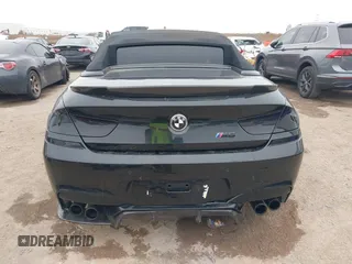 2014 BMW M6 z VIN WBSLZ9C58ED651156, wystawiony jako IAAI lot #41526192 z przebiegiem 90 642 mil mil oraz . Historia ofert i sprzedaży dostępna na DreamBid. Obrazek 16.