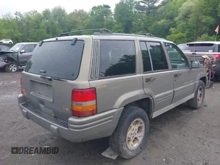 1998 Jeep Grand Cherokee Limited z VIN 1J4GZ78Y5WC261391, wystawiony jako IAAI lot #42275913 z przebiegiem 180 552 mil mil oraz . Historia ofert i sprzedaży dostępna na DreamBid. Obrazek 4.