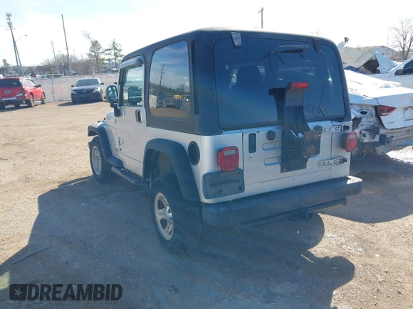 2004 Jeep Wrangler Sport Right Hand Drive with VIN 1J4F449SX4P780560, listed as a IAAI auction lot 41645721 with 146,681 mi miles. Bid and sale history available at carsss.com. Image 4.