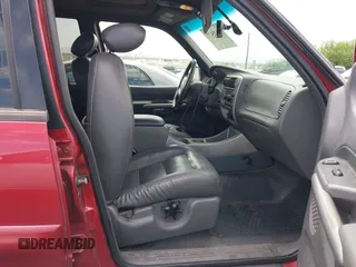 2002 Ford Explorer Sport Trac Value z VIN 1FMZU67E42UD07906, wystawiony jako IAAI lot #42625477 z przebiegiem 158 307 mil mil oraz . Historia ofert i sprzedaży dostępna na DreamBid. Obrazek 5.