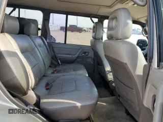 1998 Mitsubishi Montero z VIN JA4MR51R0WJ000921, wystawiony jako Copart lot #56250965 z przebiegiem 181 293 mil mil oraz Szkoda całkowita • Salvage title. Historia ofert i sprzedaży dostępna na DreamBid. Obrazek 11.