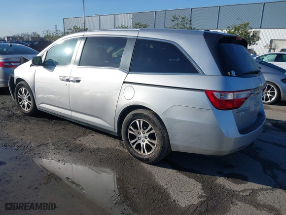 2011 Honda Odyssey EX-L with VIN 5FNRL5H6XBB057556, listed as a IAAI auction lot 41808620 with 154,449 mi miles. Bid and sale history available at carsss.com. Image 3.