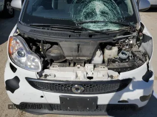2013 Smart fortwo Pure z VIN WMEEJ3BA5DK694853, wystawiony jako Copart lot #74003734 z przebiegiem 27 720 mil mil oraz Szkoda całkowita • Salvage title. Historia ofert i sprzedaży dostępna na DreamBid. Obrazek 11.
