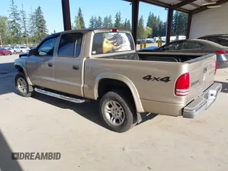 2003 Dodge Dakota SLT with VIN 1D7HG48N03S344321, listed as a IAAI auction lot 42074421 with 96,489 mi miles and . Bid and sale history available at carsss.com. Image 3.