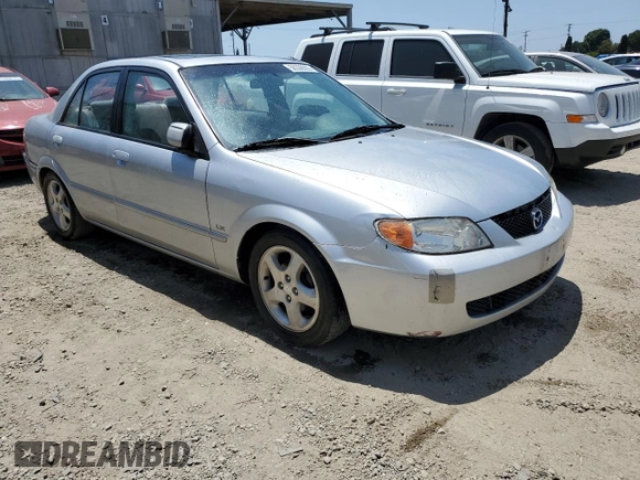 2002 Mazda Protege DX z VIN JM1BJ225920543960, wystawiony jako Copart lot #56336555 z przebiegiem 173 874 mil mil oraz Szkoda całkowita • Salvage title. Historia ofert i sprzedaży dostępna na DreamBid. Obrazek 4.