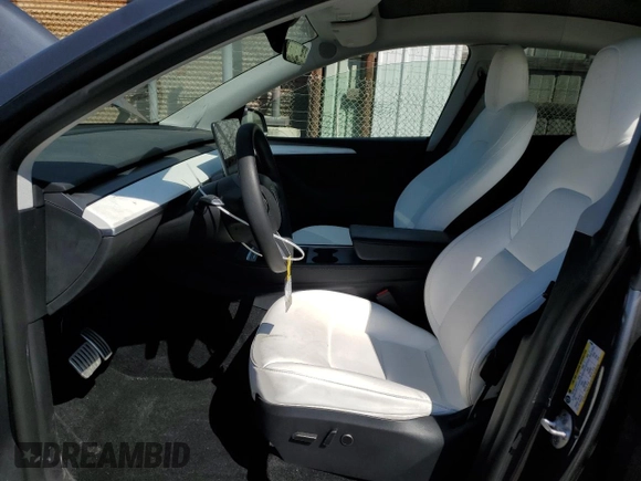 2023 Tesla Model Y Performance with VIN 7SAYGDEF0PF915030, listed as a Copart auction lot 50159375 with 19,772 mi miles and Salvage Title. Bid and sale history available at DreamBid. Image 7.