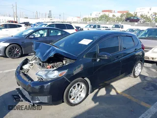 2015 Honda Fit LX z VIN 3HGGK5H57FM717203, wystawiony jako IAAI lot #41615075 z przebiegiem 99 933 mil mil oraz . Historia ofert i sprzedaży dostępna na DreamBid. Obrazek 17.