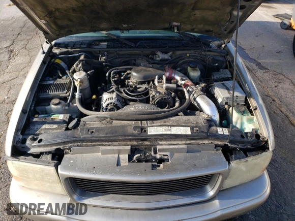 2000 GMC Sonoma SLS z VIN 1GTCS19W2Y8161077, wystawiony jako Copart lot #82616024 z przebiegiem 212 356 mil mil oraz Szkody całkowita. Historia ofert i sprzedaży dostępna na DreamBid. Obrazek 11.