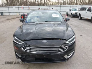 2017 Ford Fusion Titanium z VIN 3FA6P0K98HR200272, wystawiony jako IAAI lot #41905017 z przebiegiem 104 132 mil mil oraz . Historia ofert i sprzedaży dostępna na DreamBid. Obrazek 12.