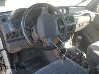 1995 Mitsubishi Montero z VIN JA4MR41H3SJ004800, wystawiony jako Copart lot #72036354 z przebiegiem 209 635 mil mil oraz Szkody całkowita. Historia ofert i sprzedaży dostępna na DreamBid. Obrazek 8.