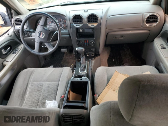 2005 GMC Envoy SLT with VIN 1GKDT13S152124404, listed as a Copart auction lot 64011494 with 212,951 mi miles and Salvage Title. Bid and sale history available at DreamBid. Image 8.
