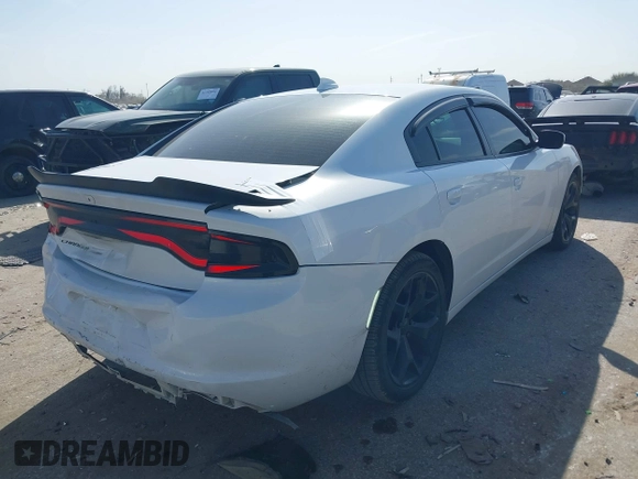 2015 Dodge Charger SXT with VIN 2C3CDXHG8FH725446, listed as a IAAI auction lot 41742400 with 84,579 mi miles and . Bid and sale history available at DreamBid. Image 4.