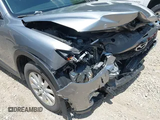 2014 Mazda CX-5 Sport with VIN JM3KE2BEXE0329303, listed as a IAAI auction lot 42556908 with 127,836 mi miles and . Bid and sale history available at DreamBid. Image 6.