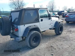 2003 Jeep Wrangler X with VIN 1J4FA39S33P363153, listed as a IAAI auction lot 41584805 with 160,676 mi miles. Bid and sale history available at carsss.com. Image 4.