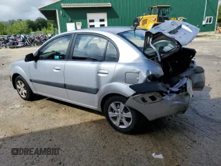 2009 Kia Rio LX with VIN KNADE223396548989, listed as a Copart auction lot 64964304 with 150,426 mi miles and Salvage Title. Bid and sale history available at carsss.com. Image 2.