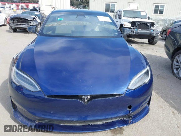 2021 Tesla Model S Long Range with VIN 5YJSA1E51MF442874, listed as a IAAI auction lot 39406495 with 36,127 mi miles and . Bid and sale history available at DreamBid. Image 13.