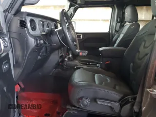 2022 Jeep Wrangler Unlimited High Tide with VIN 1C4HJXDG2NW221829, listed as a Copart auction lot 64836074 with 3,394 mi miles and Salvage Title. Bid and sale history available at DreamBid. Image 7.