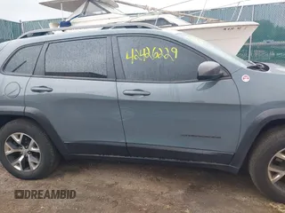 2014 Jeep Cherokee Trailhawk with VIN 1C4PJMBB5EW156315, listed as a IAAI auction lot 42426229 with 154,019 mi miles and . Bid and sale history available at DreamBid. Image 14.