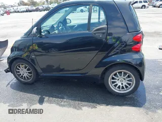 2012 Smart fortwo Pure z VIN WMEEJ3BA1CK556029, wystawiony jako IAAI lot #42173735 z przebiegiem 85 133 mil mil oraz . Historia ofert i sprzedaży dostępna na DreamBid. Obrazek 14.