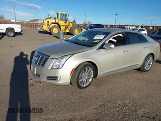 2014 Cadillac XTS Luxury z VIN 2G61N5S3XE9298471, wystawiony jako IAAI lot #41069292 z przebiegiem 92 112 mil mil oraz . Historia ofert i sprzedaży dostępna na DreamBid. Obrazek 16.