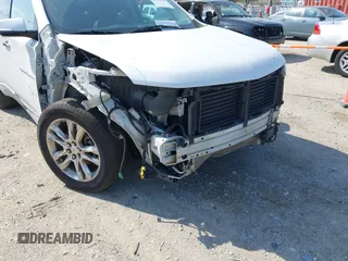 2018 Chevrolet Traverse High Country with VIN 1GNEVKKW9JJ111962, listed as a IAAI auction lot 42118324 with 104,311 mi miles and . Bid and sale history available at DreamBid. Image 6.