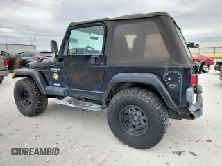 2000 Jeep Wrangler Sahara with VIN 1J4FA59S1YP777549, listed as a Copart auction lot 63622335 with 197,426 mi miles and Clean title. Bid and sale history available at DreamBid. Image 2.