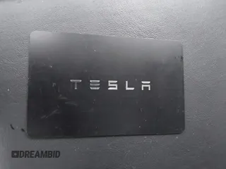 2018 Tesla Model 3 Long Range Battery with VIN 5YJ3E1EA3JF023300, listed as a IAAI auction lot 41925504 with 100,512 mi miles and . Bid and sale history available at DreamBid. Image 11.