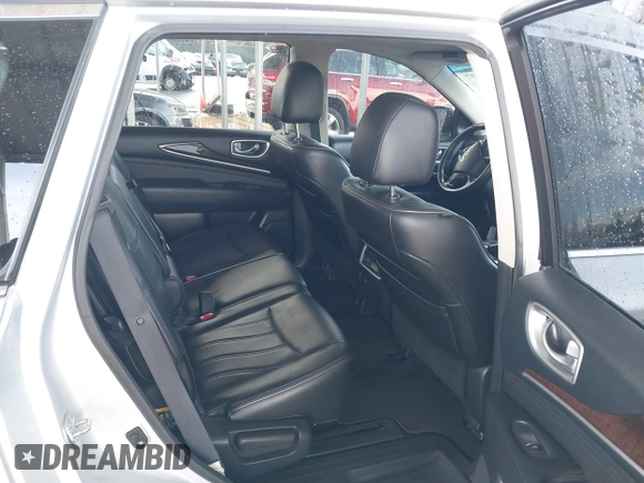 2013 Infiniti JX35 z VIN 5N1AL0MM3DC334693, wystawiony jako IAAI lot #41576207 z przebiegiem 113 677 mil mil oraz . Historia ofert i sprzedaży dostępna na DreamBid. Obrazek 8.