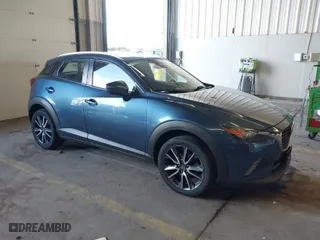 2018 Mazda CX-3 Touring with VIN JM1DKFC78J1323439, listed as a IAAI auction lot 41725784 with 134,055 mi miles. Bid and sale history available at carsss.com. Image 1.