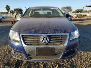 2009 Volkswagen Passat Sedan Turbo with VIN WVWJK73C89E027086, listed as a Copart auction lot 77447034 with 51,672 mi miles and Salvage Title. Bid and sale history available at carsss.com. Image 5.