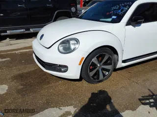 2012 Volkswagen Beetle 2.0T Turbo PZEV with VIN 3VW4A7AT6CM648540, listed as a IAAI auction lot 41326503 with 118,929 mi miles. Bid and sale history available at carsss.com. Image 2.