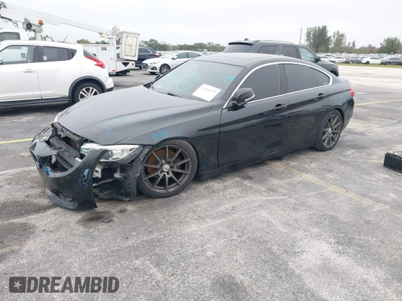 2016 BMW 4 Series 428i xDrive with VIN WBA4C9C58GG136248, listed as a IAAI auction lot 41346270 with 129,464 mi miles and . Bid and sale history available at carsss.com. Image 2.