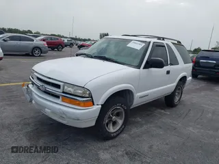 2003 Chevrolet Blazer Xtreme z VIN 1GNCS18X33K152868, wystawiony jako IAAI lot #39801584 z przebiegiem 167 157 mil mil oraz . Historia ofert i sprzedaży dostępna na DreamBid. Obrazek 2.