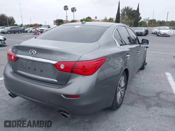 2015 Infiniti Q50 Premium with VIN JN1BV7AP6FM357265, listed as a IAAI auction lot 42104440 with 83,404 mi miles. Bid and sale history available at carsss.com. Image 4.