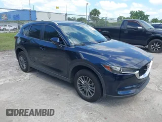 2017 Mazda CX-5 Touring with VIN JM3KFACL0H0227615, listed as a IAAI auction lot 42063618 with 72,291 mi miles. Bid and sale history available at carsss.com. Image 1.