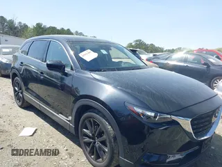 2023 Mazda CX-9 Touring Plus with VIN JM3TCBAY9P0657854, listed as a IAAI auction lot 41931409 with 54,036 mi miles and . Bid and sale history available at DreamBid. Image 1.