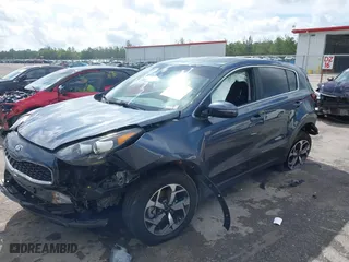 2020 Kia Sportage LX with VIN KNDPM3AC3L7713581, listed as a IAAI auction lot 40255286 with 90,221 mi miles. Bid and sale history available at carsss.com. Image 2.