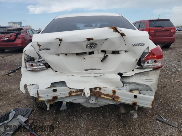 2009 Toyota Yaris with VIN JTDBT903991338082, listed as a Copart auction lot 51156955 with 328,941 mi miles and Salvage Title. Bid and sale history available at carsss.com. Image 6.