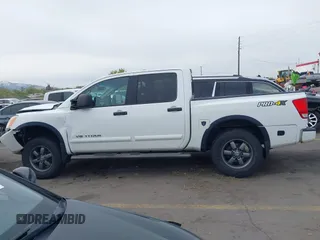 2014 Nissan Titan Pro-4X with VIN 1N6BA0ECXEN501915, listed as a IAAI auction lot 42097967 with 120,851 mi miles and . Bid and sale history available at DreamBid. Image 14.