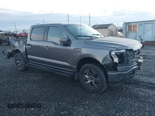 2023 Ford F-150 Lightning Pro with VIN 1FT6W1EV6PWG26596, listed as a IAAI auction lot 40862334 with 13,857 mi miles. Bid and sale history available at carsss.com. Image 1.