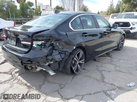 2022 BMW 3 Series 330e with VIN 3MW5P7J06N8C50460, listed as a IAAI auction lot 41688267 with 27,707 mi miles. Bid and sale history available at carsss.com. Image 4.