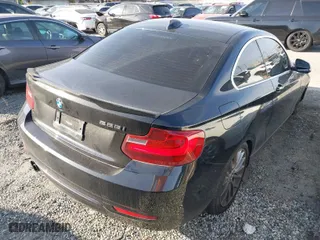 2016 BMW 2 Series 228i with VIN WBA1F9C5XGV544661, listed as a IAAI auction lot 41516695 with 84,243 mi miles. Bid and sale history available at carsss.com. Image 4.