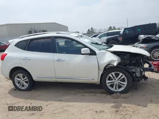 2013 Nissan Rogue S with VIN JN8AS5MV7DW104560, listed as a IAAI auction lot 41792395 with 104,201 mi miles and . Bid and sale history available at DreamBid. Image 14.