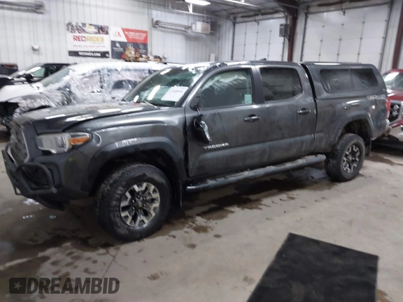 2016 Toyota Tacoma SR5 with VIN 3TMDZ5BNXGM009423, listed as a IAAI auction lot 41008068 with 107,426 mi miles and . Bid and sale history available at DreamBid. Image 2.