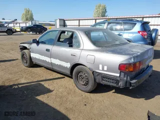 1996 Toyota Camry DX with VIN 4T1BG12KXTU655820, listed as a IAAI auction lot 42093458 with 197,247 mi miles. Bid and sale history available at carsss.com. Image 3.