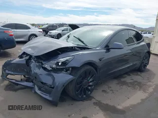 2022 Tesla Model 3 Performance with VIN 5YJ3E1EC3NF296891, listed as a IAAI auction lot 41808329 with 82,682 mi miles and . Bid and sale history available at DreamBid. Image 2.