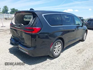 2023 Chrysler Pacifica Touring L with VIN 2C4RC1BG1PR606504, listed as a IAAI auction lot 42647652 with 41,598 mi miles and . Bid and sale history available at DreamBid. Image 4.