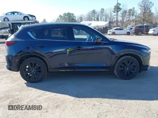 2022 Mazda CX-5 2.5 Turbo with VIN JM3KFBAY4N0534690, listed as a IAAI auction lot 41716988 with 23,910 mi miles and . Bid and sale history available at carsss.com. Image 13.