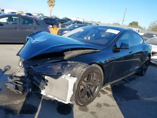 2013 Tesla Model S with VIN 5YJSA1AC3DFP10599, listed as a IAAI auction lot 40869838 with 99,047 mi miles. Bid and sale history available at carsss.com. Image 21.